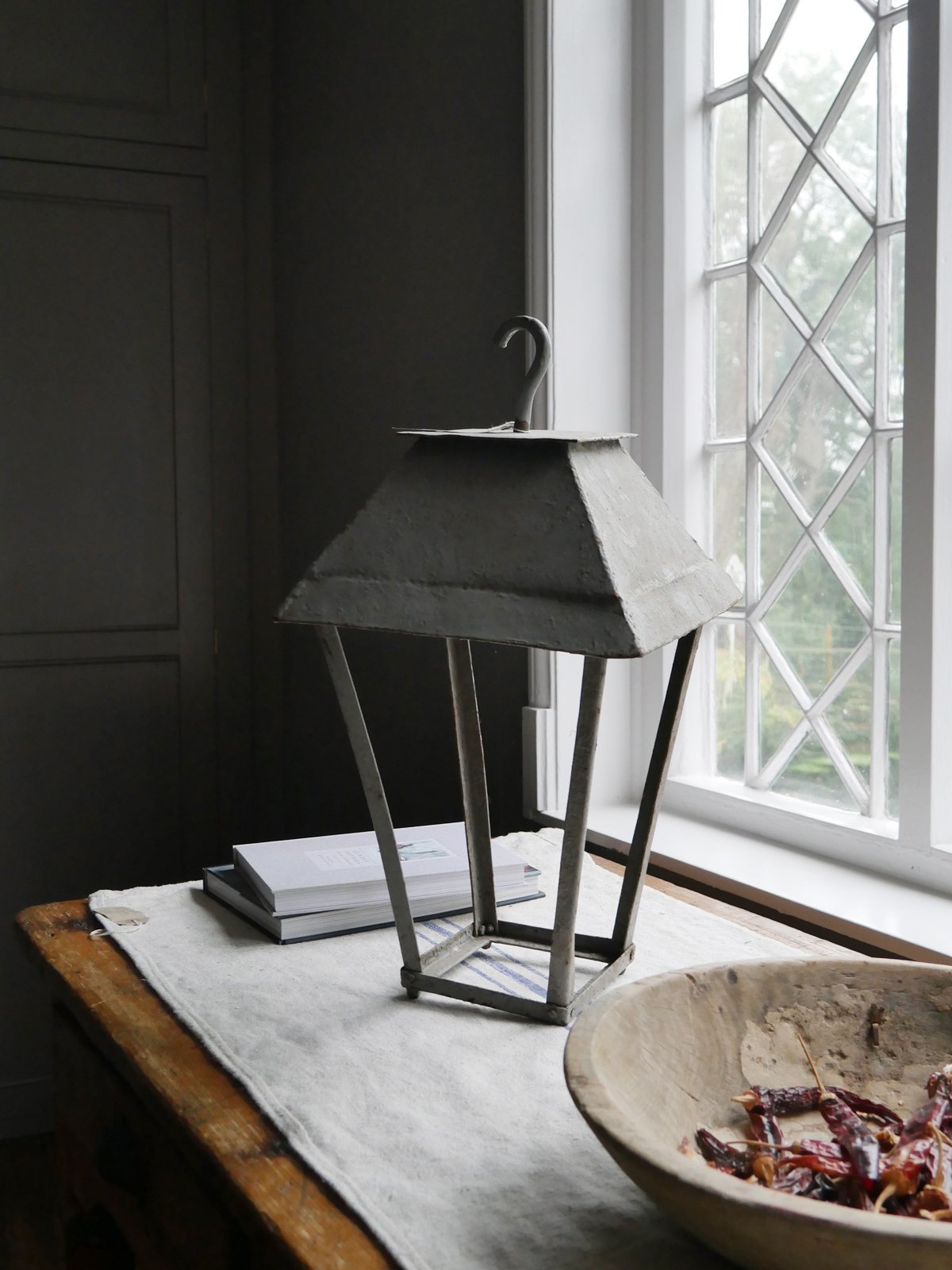 A simple lantern with a candle popped inside can transform a dull corner into something special.