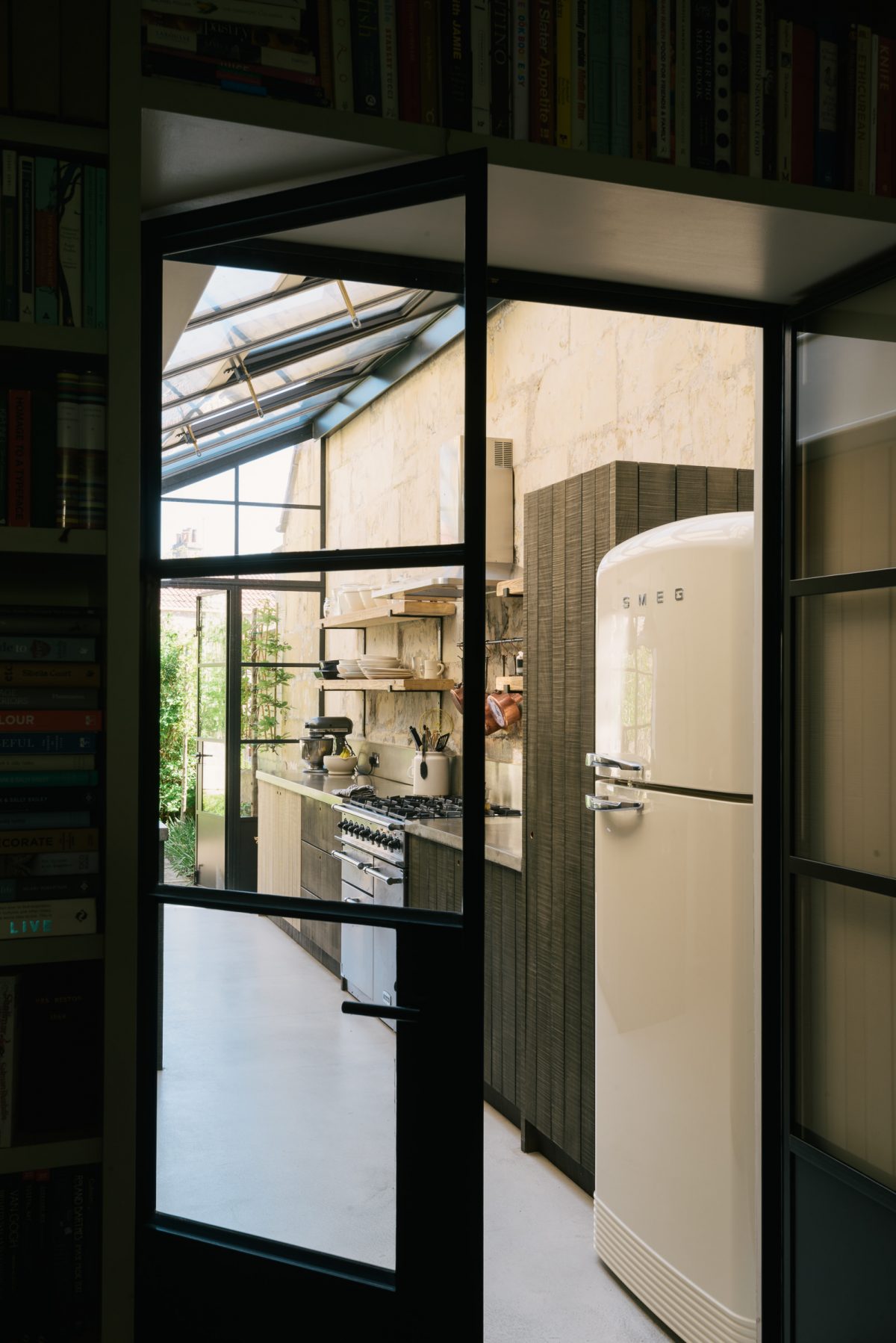 A view through Crittall-style doors into this cool Sebastian Cox Kitchen.