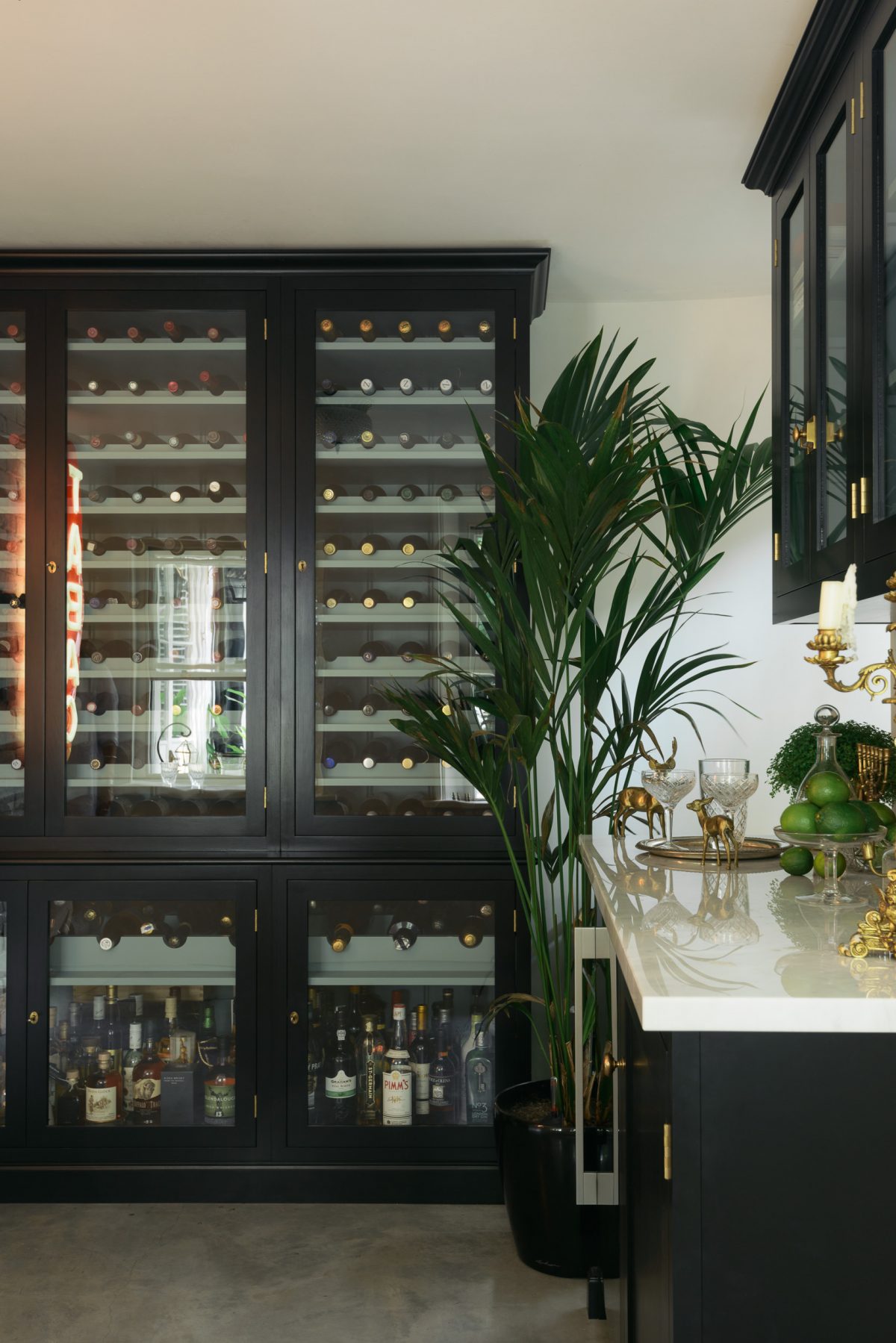 A bespoke Curiosity Cupboard has become the most beautiful wine storage solution, made to measure for this glamorous Regent's Park Cellar Bar.