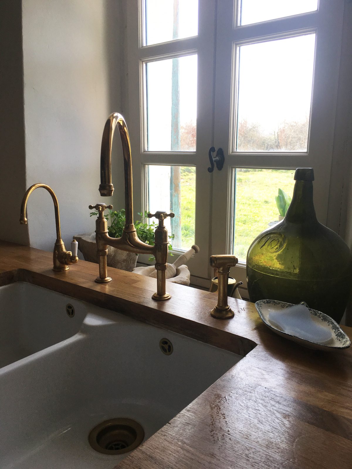 A deVOL Ionian and mini hot tap, both in our exclusive Aged Brass finish - made in collaboration with Perrin & Rowe.