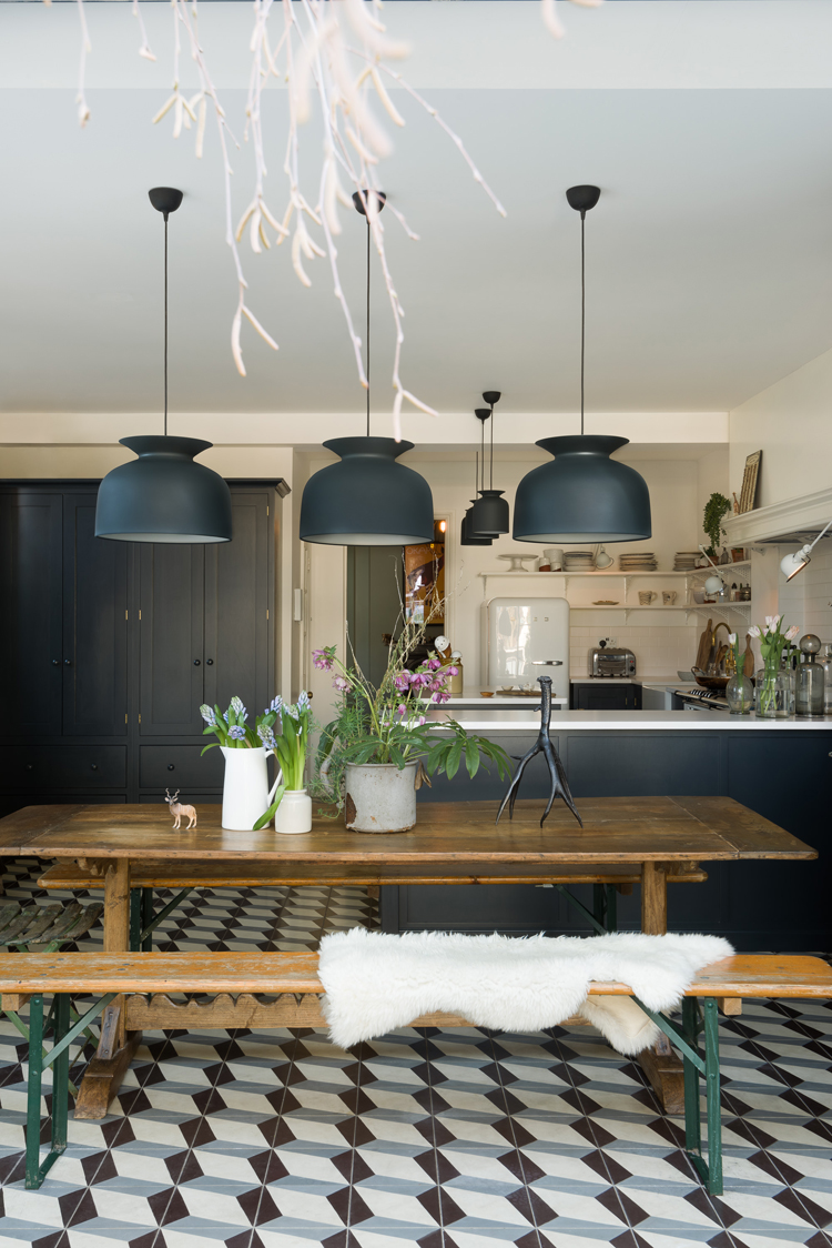 I love this vintage wooden table and bench seating in the Marlow Kitchen by deVOL