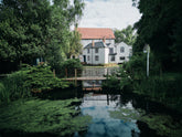 The home of deVOL kitchens in Leicestershire sits beside the Cotes pond and lush green British countryside.