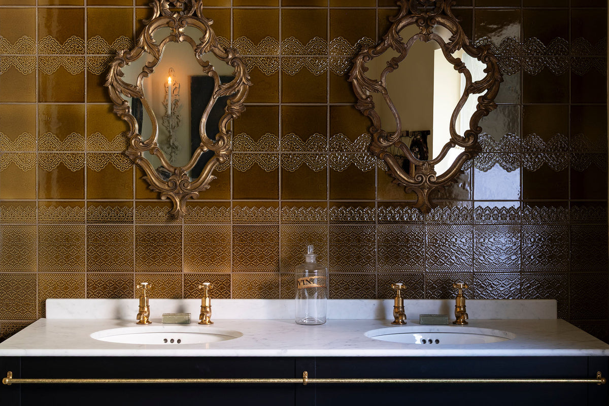 A closer look at the elegant powder room with twin printer's black wash stand, two vintage mirrors, and the sepia lace market tiles as the splash back.