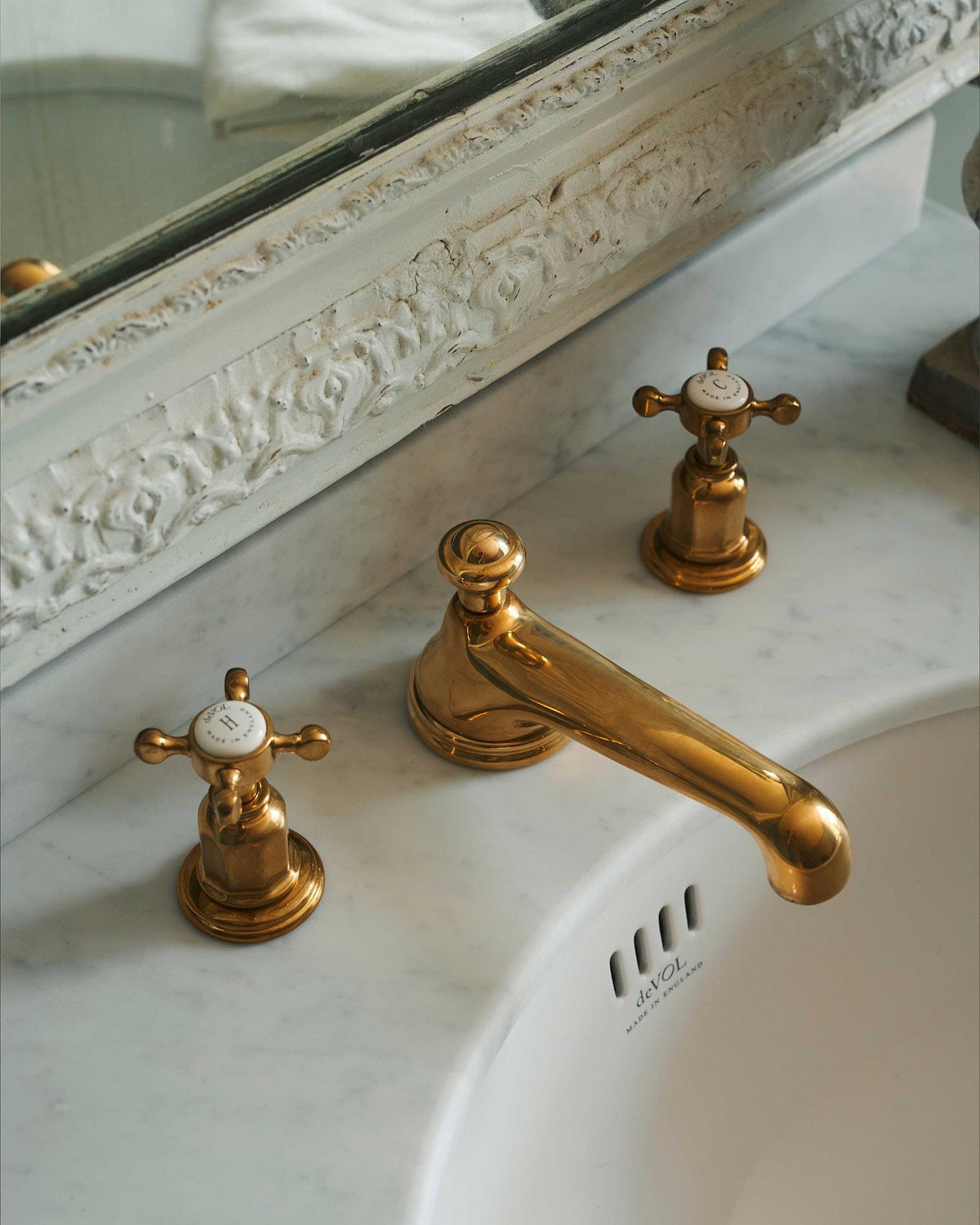 A detailed view of an aged brass towel rail attached to the right side of a Victorian-inspired washstand, a vintage lace hand towel hangs from the rail. | Right Towel Rail shown TEST