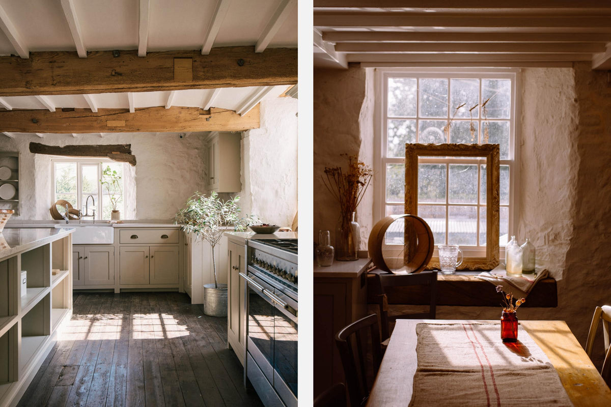 A sink run in a simple English farmhouse kitchen at deVOL’s headquarters, Cotes Mill. Low-exposed wooden beams, antique furnitures, and worn floorboards create a rustic atmosphere, while textured off-white walls add charm.