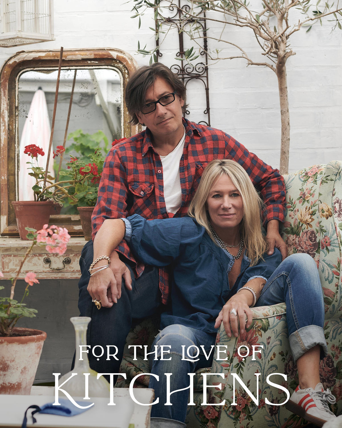 The two directors of deVOL sat on a chair with the tv show logo "For the Love of Kitchens" at the bottom.