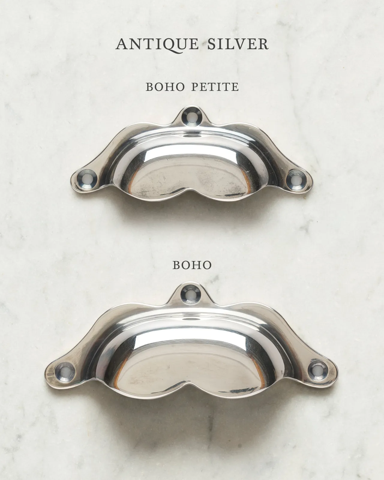 Two bohemian-style cup handles for a kitchen cupboard or drawer with a tarnished silver finish. There is a large and a small size.