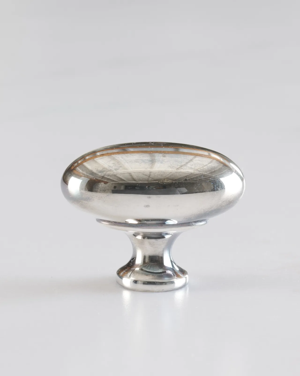 A ‘Large’ oval-shaped knob for a kitchen cupboard or drawer with a tarnished silver finish.