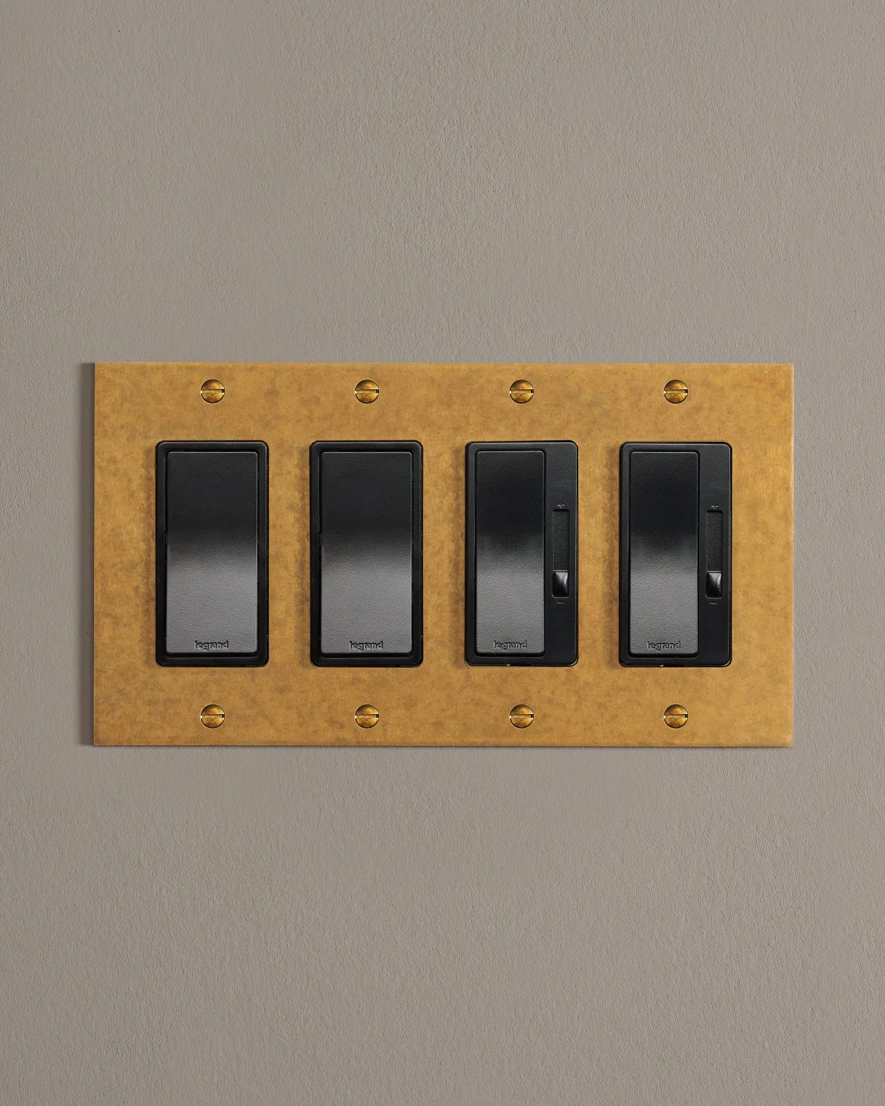 a front on shot of a mixed configuration on an aged brass plate.