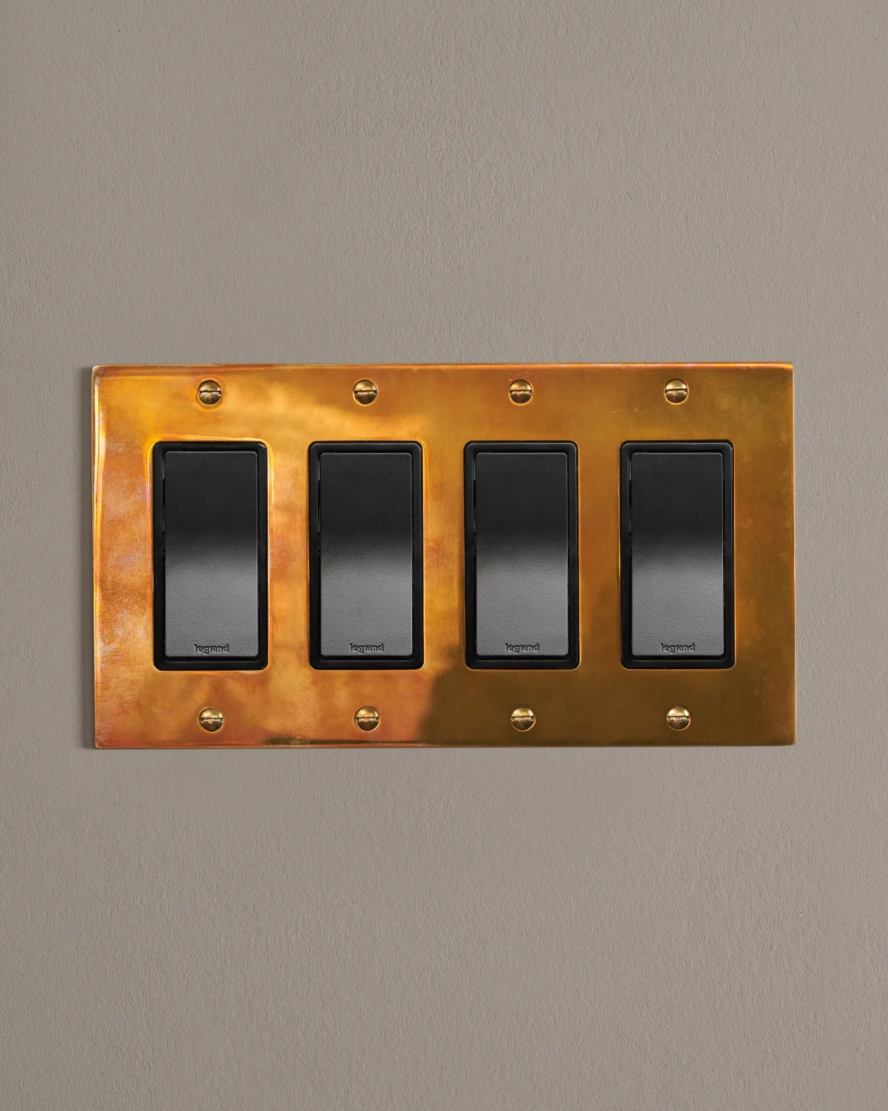 a front on shot of the rocker switch on an heirloom brass plate.