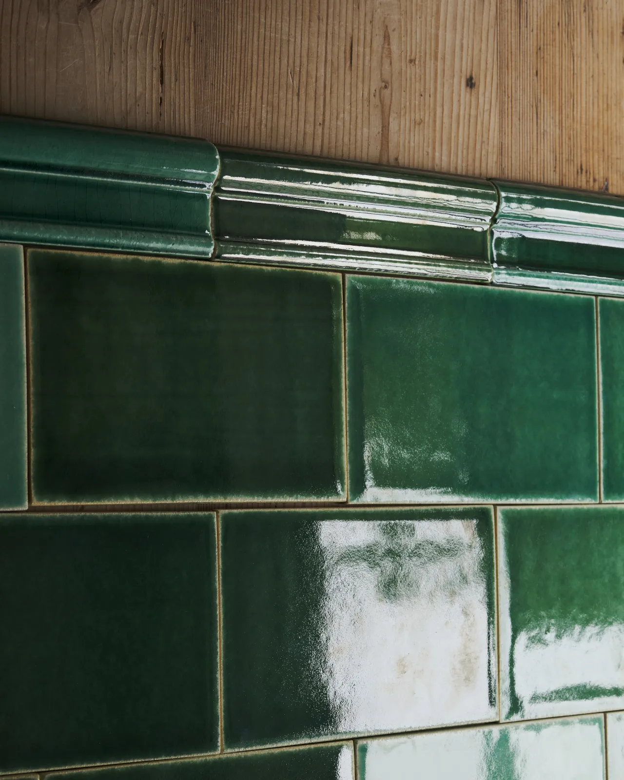 a side view of the emerald green tiles with the border tiles.