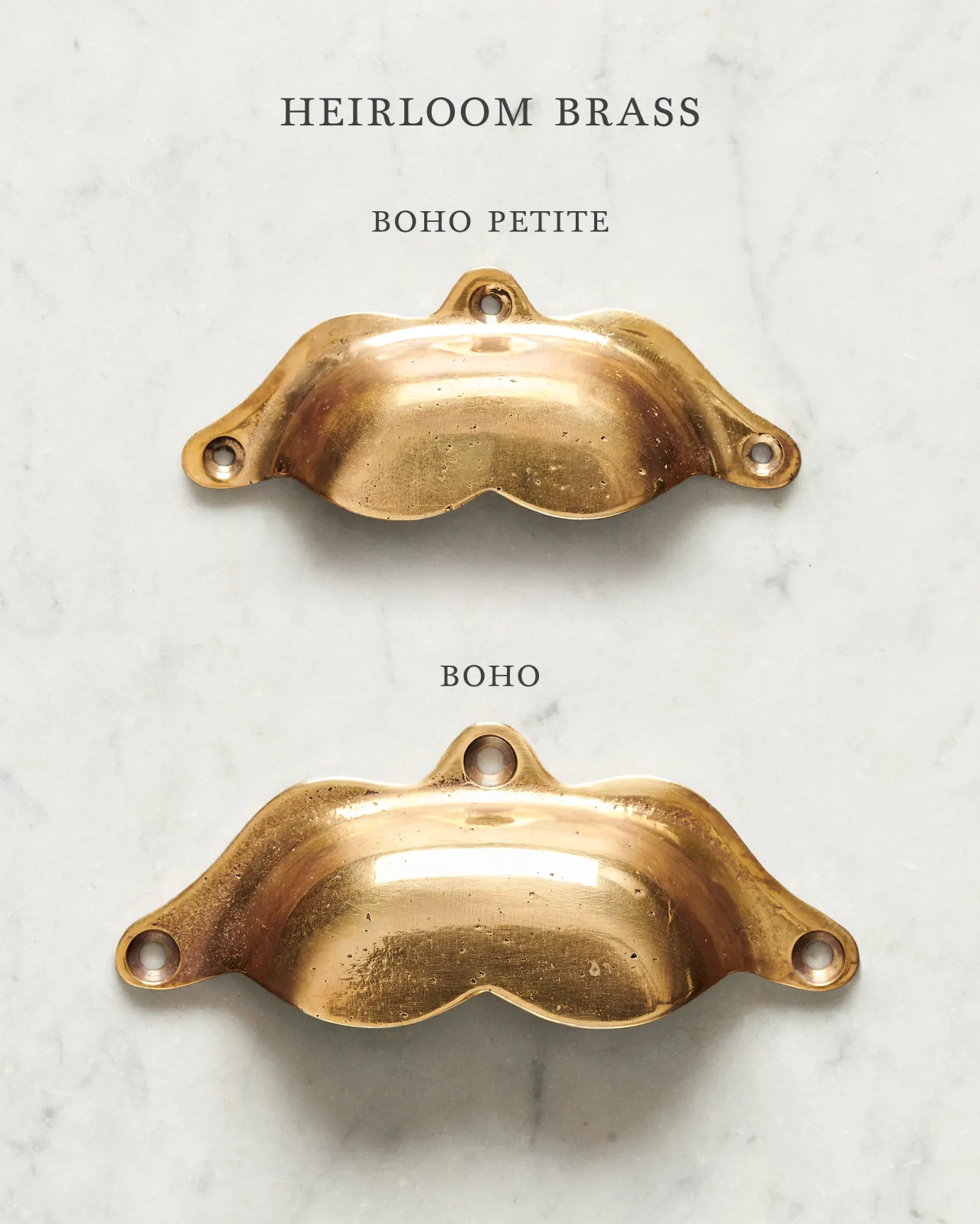 Two bohemian-style cup handles for a kitchen cupboard or drawer with a warm burnished brass finish. There is a large and a small size.