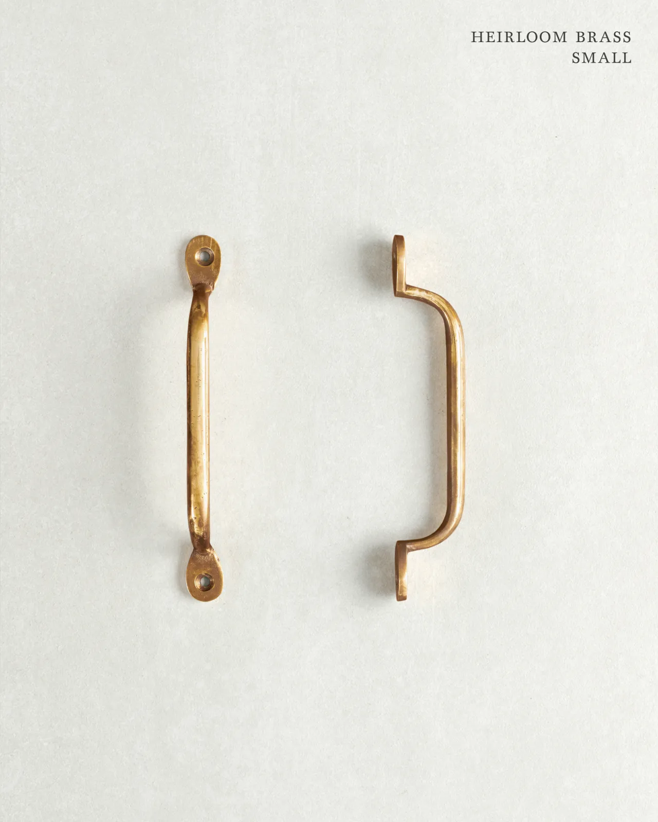 A ‘Small’ classic pull handle for a kitchen cupboard or drawer with a warm burnished brass finish.