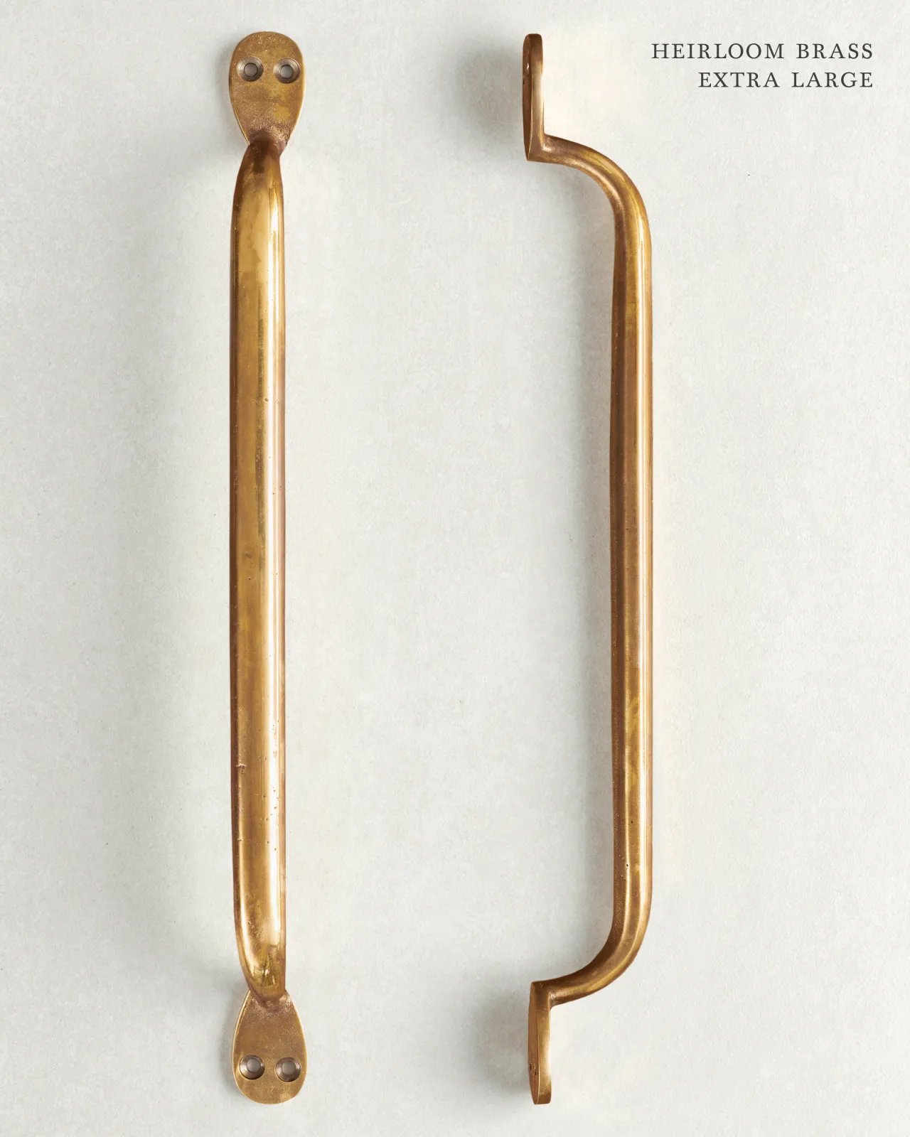 An ‘Extra Large’ classic pull handle for a kitchen cupboard or drawer with a warm burnished brass finish.