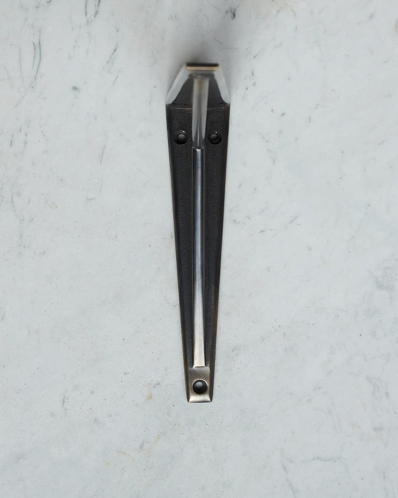 A front profile view of a classic utilitarian shelf bracket in a dark oxidised brass finish.